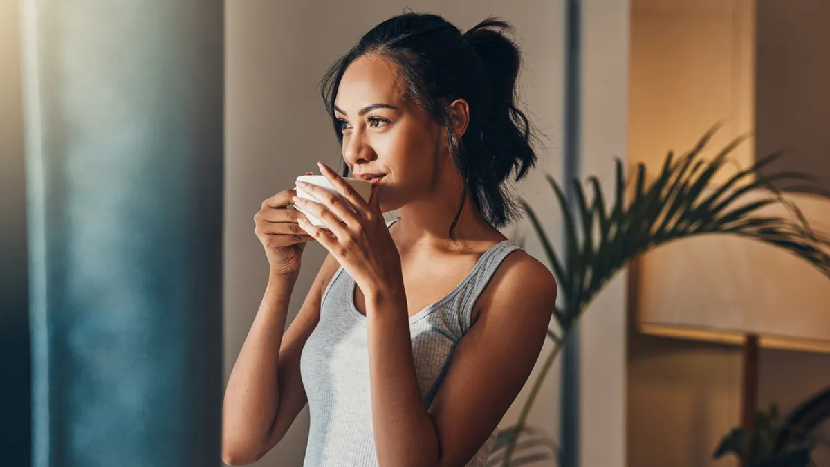 girl-drinking-cup-of-hot-drink.jpg