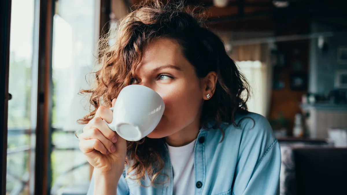 woman-drinking-cup-of-hot-drink.jpg
